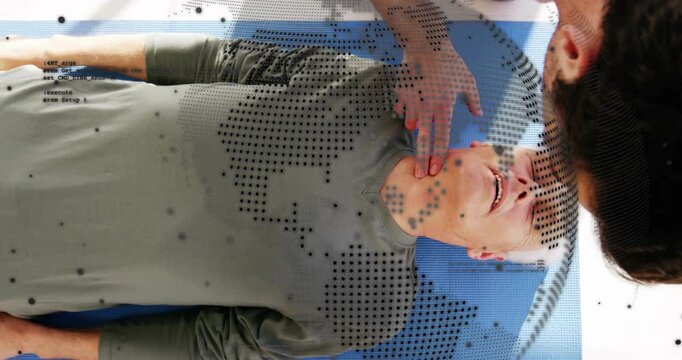 Trainer tapping shoulder checking pulse and compressing chest on blue mat with AR overlay for CPR