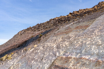 Charlie Brown Outcrop. Cutting or Cut (earthworks). Shoshone in Inyo County, California geology.  devitrified pumice tuff, welded tuff and vesicular vitrophyre. The volcanic rocks are cut by faults. 
