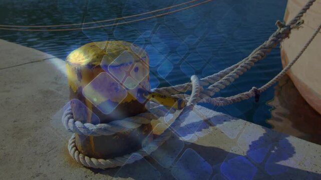 Sunlight flaring yellow bollard starting blue grid sliding over rope fading restoring pier view