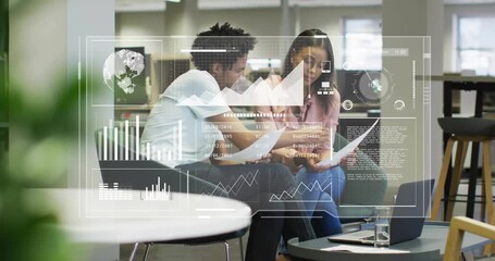Man showing coworker printed report triggers data charts overlay guiding business review on laptop - Powered by Adobe