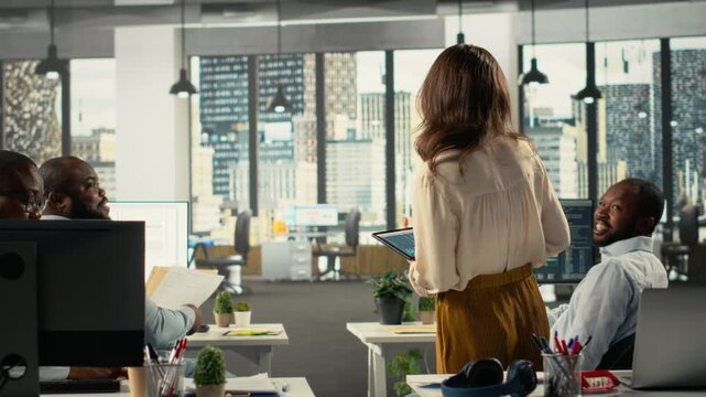 Business colleagues using computers to analyze insights and performance metrics, making projections and data visualization. Employees share reports to improve corporate development. Camera B. - Powered by Adobe