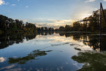 Silhouetted riverbanks in backlit in autumn. Willamette River in Newberg, Oregon