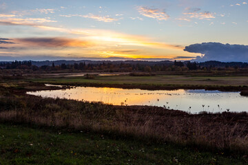 Colorful sunset over Tualatin River in Tualatin River Wildlife Refuge in Sherwood, Oregon