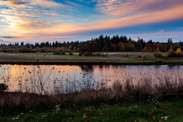River landscape with vivid colors of sunset. Tualatin River in Oregon