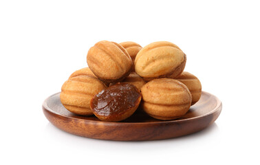 Delicious nut shaped cookies with boiled condensed milk isolated on white