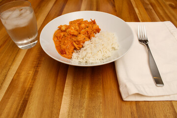 Close-Up of Prepared Chicken Curry and White Rice Dish