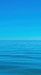 Fototapeta premium Deep vibrant azure water reflecting the infinite expanse of a clear, brilliant blue sky on a warm, sunny afternoon ,deep ,purity ,vibrant