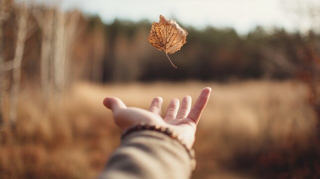 Person letting go of the past year, symbolic emotional release and new beginning gesture