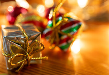 Christmas golden boxes and ornaments in red, gold and green with glittering patterns