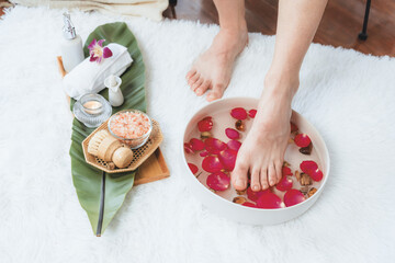 Woman indulges in blissful foot massage at luxurious spa salon while masseur give reflexology...