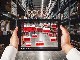 Smart warehouse management system using augmented reality technology to identify package picking and delivery . Future concept of supply chain and logistic business .