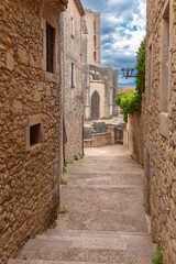 Gothic church and old stone alley in Girona Spain