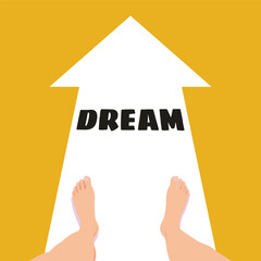 Feet standing at the starting point of a white arrow with the word DREAM pointing forward