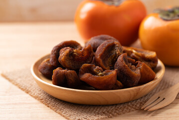 Dried persimmon on wooden plate ready to eating, Sweet and chewy