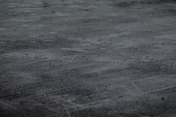 Wet black asphalt when raining. copy space, empty, free, negative, text, design. dark. raindrops. water.