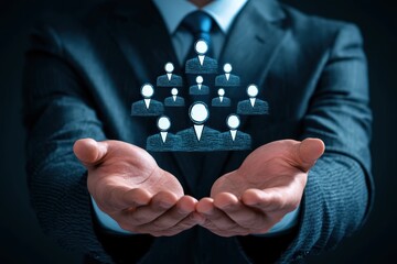 Human Capital in Focus: A business professional cradles a digital representation of a diverse team, symbolizing human capital and the value of collaborative success in a modern business landscape. 