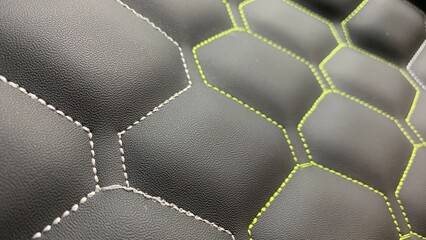 Beautiful thread stitching on the black leather. purpose for background