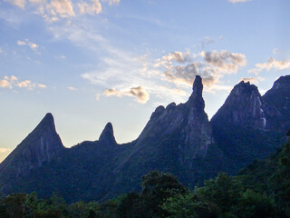 Jagged mountain peaks against a cloudy sky