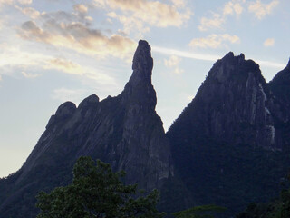 Towering rock formation against twilight sky