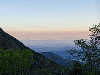 Hazy mountain landscape at dawn with soft sky