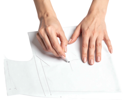 Hands tracing a garment pattern on white paper, isolated on black. Tracing a neckline with a pencil