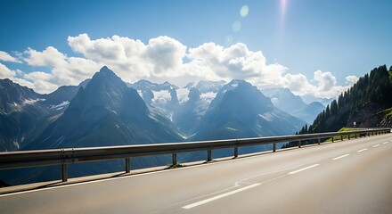 Scenic Mountain Road with Majestic Peaks and Blue Sky.