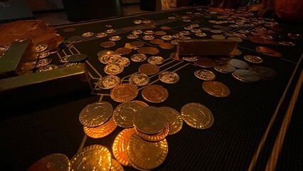 gold coin on black table.