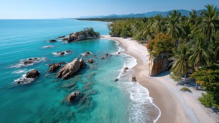 Fototapeta premium Vast Panoramic View of a Tropical Coastline Featuring Turquoise Waters Rocky Outcroppings Lush Green Palm Trees and Sandy Beaches Under a Clear Blue Sky on a Sunny Day