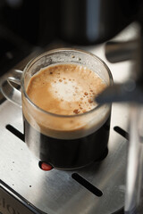 Freshly brewed espresso in a coffee shop setting