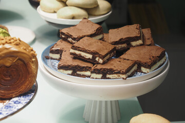 Delicious dessert platter with brownies and pastries at cafe