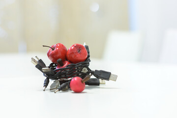 USB cables woven into a basket to hold Apples - horizontal