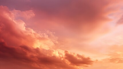 Obraz premium Vibrant pink and orange clouds illuminate the atmosphere during a striking sunset or sunrise
