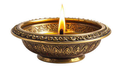 Lit oil lamp with intricate gold metal design on a black background
