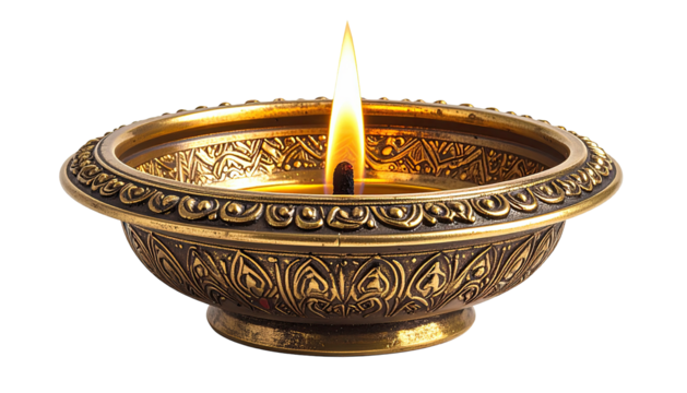 Lit oil lamp with intricate gold metal design on a black background