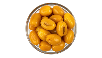 Olives, pitted and golden, displayed in glass bowl above black