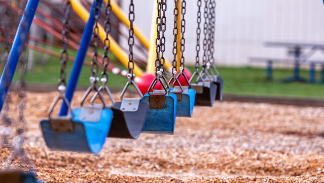 View at empty swing in the community park