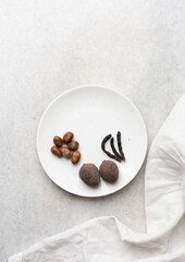 Overhead view of mise en place of ingredients for making Nigerian goat pepper soup, top view of spices for making pepper soup