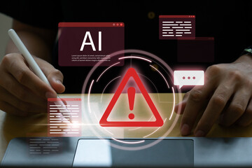 Young man using laptop with system warning alert