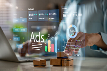 Businessman using laptop to monitor online advertising metrics through a digital dashboard.