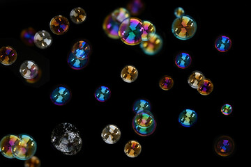 Soap bubbles isolated on a black background.