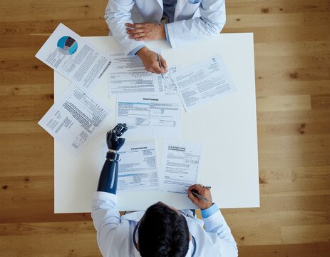 Medical engineers designing advanced prosthetic limbs with neural control, bionic tec - Powered by Adobe