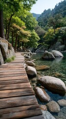 Weathered wooden boardwalk curves along a clear stream with large river stones and lush green trees under bright sunlight a serene natural landscape in summer