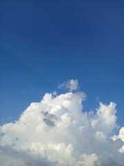 Blue Sky With Fluffy White Clouds in Summer.