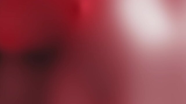 Dark red gradient background featuring a smooth blend of deep red and glowing white light for a modern design concept