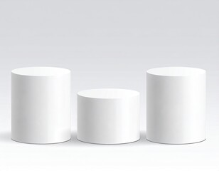 Three white cylinders stand on gray gradient background