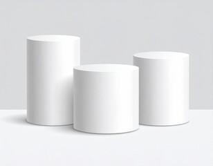 3 white cylinder podiums, different heights, gray backdrop