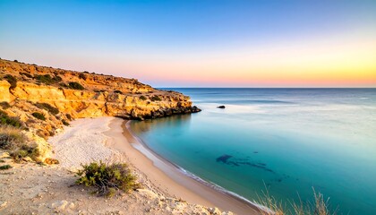 Obraz premium Tranquil coastal scene at sunrise