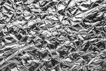 Shiny metal silver gray foil leaf crumpled texture background