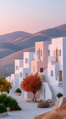 Whitewashed Houses on a Hillside Town Under a Soft Sunset Sky with Warm Golden Light Illuminating the Architecture and Autumn Tree