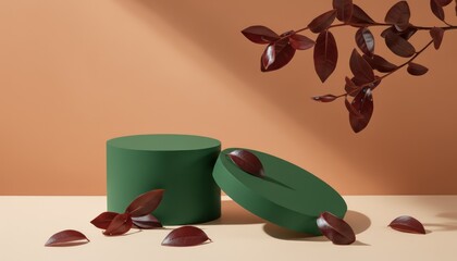 A dark green cylindrical podium and a matching oval shape rest on a warm peach surface, surrounded by fallen red leaves